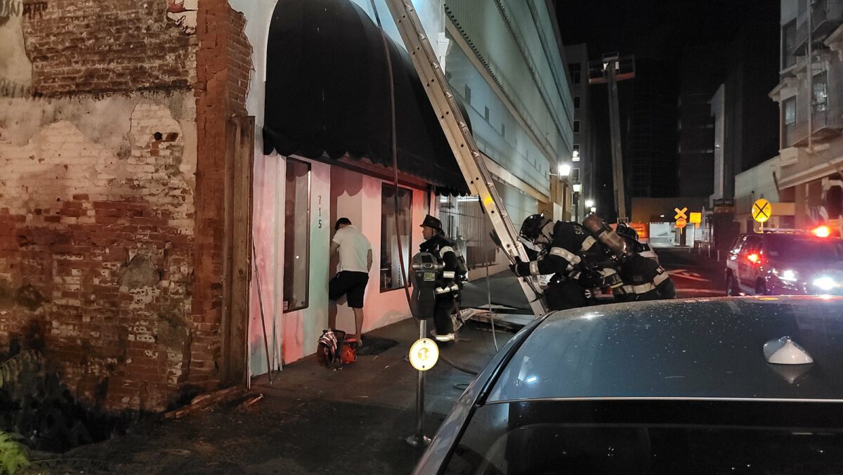 FIRE: Debris fire threatens downtown business